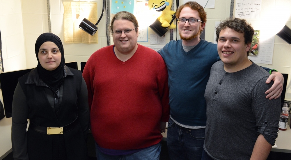 Mona Minkara poses for a portrait in Kolthoff Hall with her team on Tuesday, March 20, 2017. Minkara is the University's first blind, female, computational chemist.